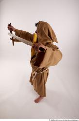 JOEL_ADAMSON WITH CRUCIFIX AND SWORD